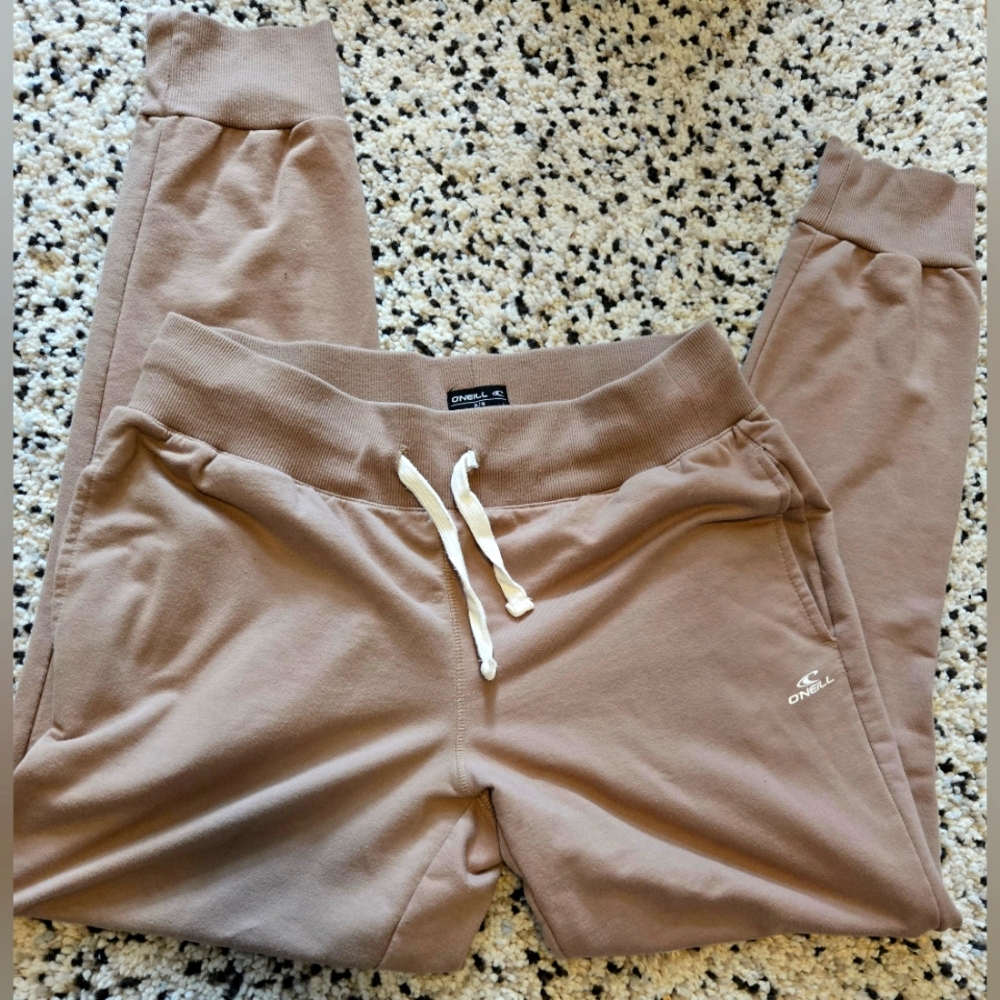 O'Neill brand. Tan joggers. Size medium. Elastic waist. Ribbed cuffs.